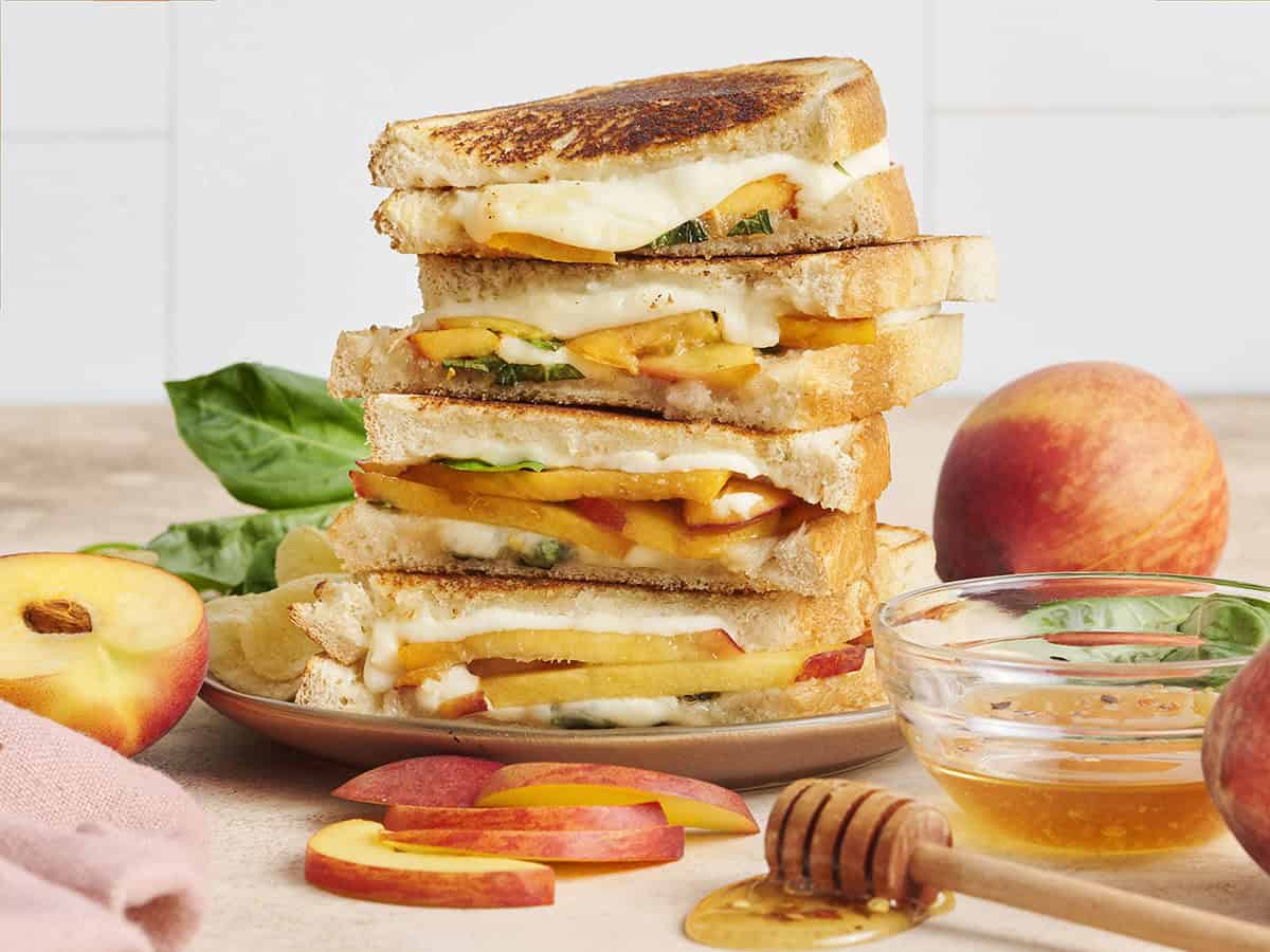 A stack of honey peach grilled cheese sandwiches.